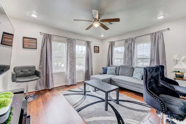 a living room with furniture and a window