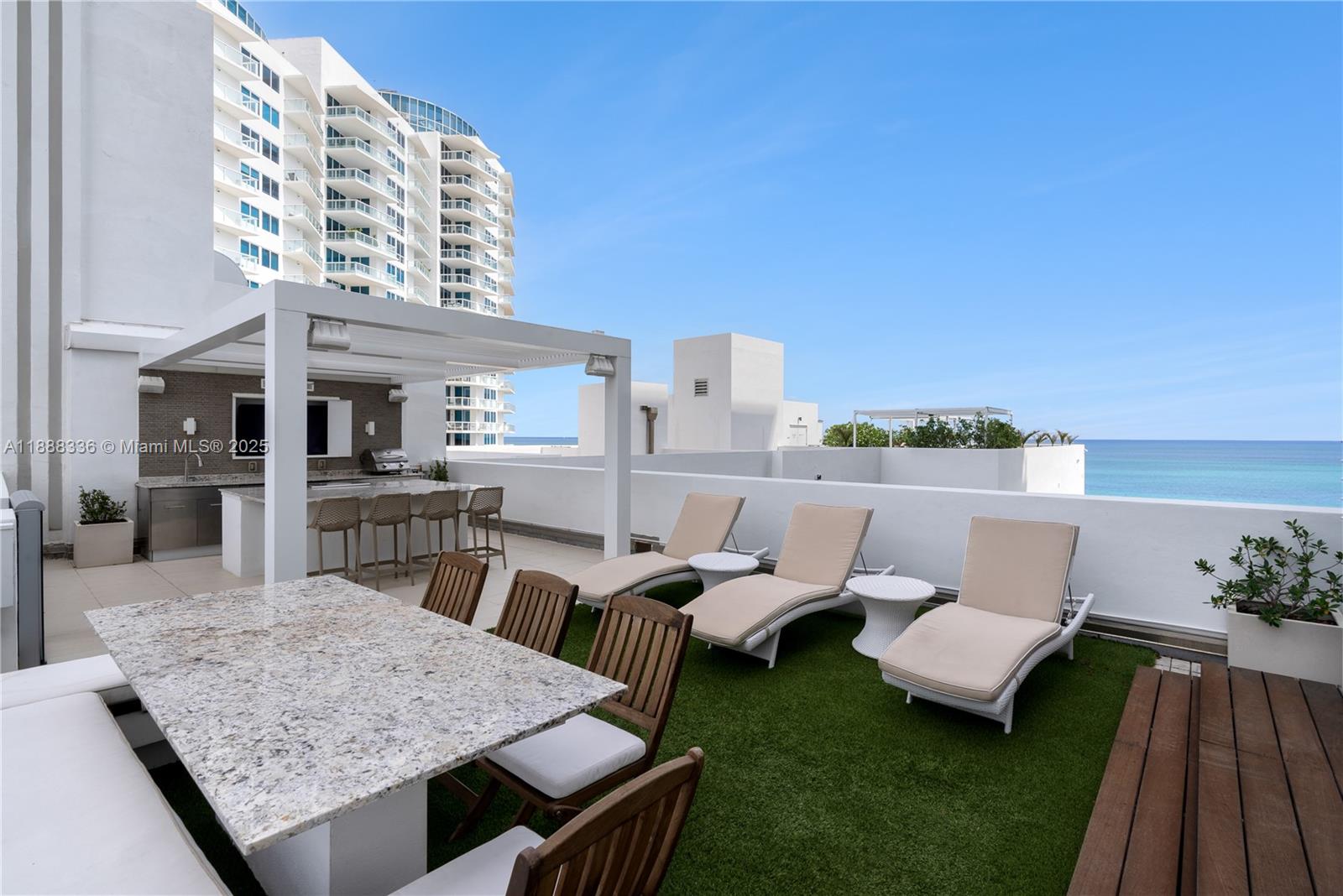 3739 Collins Avenue, Unit N605 Miami Beach, FL 33140 - Photo 15 of 20 a terrace of a house with outdoor seating