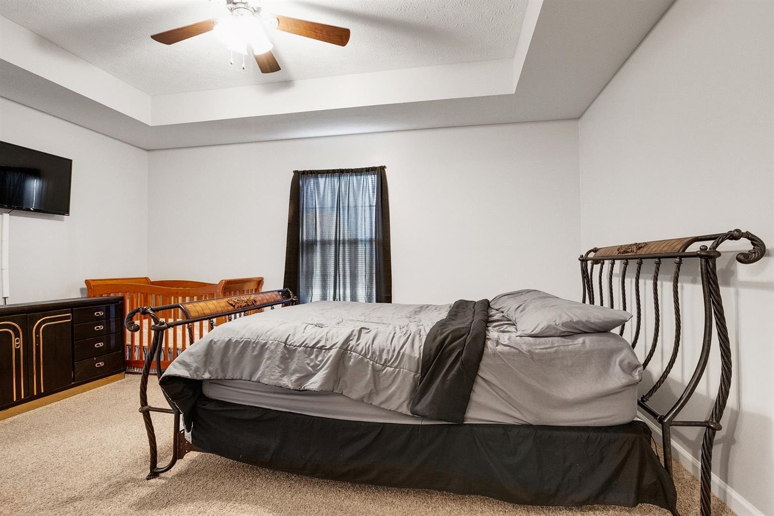 372 Freeland Road Portland, TN 37148 - Photo 13 of 41 a bedroom with a bed and wooden floor