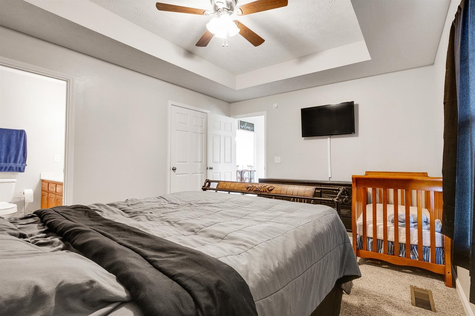 372 Freeland Road Portland, TN 37148 - Photo 14 of 41 a bedroom with a bed and a flat screen tv