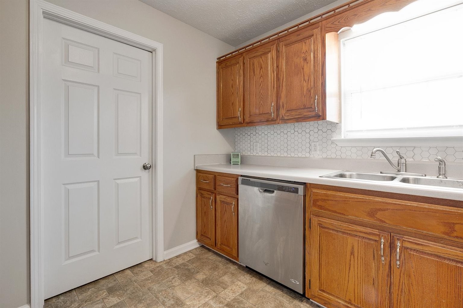 372 Freeland Road Portland, TN 37148 - Photo 18 of 41 a room with granite countertop cabinets sink and window