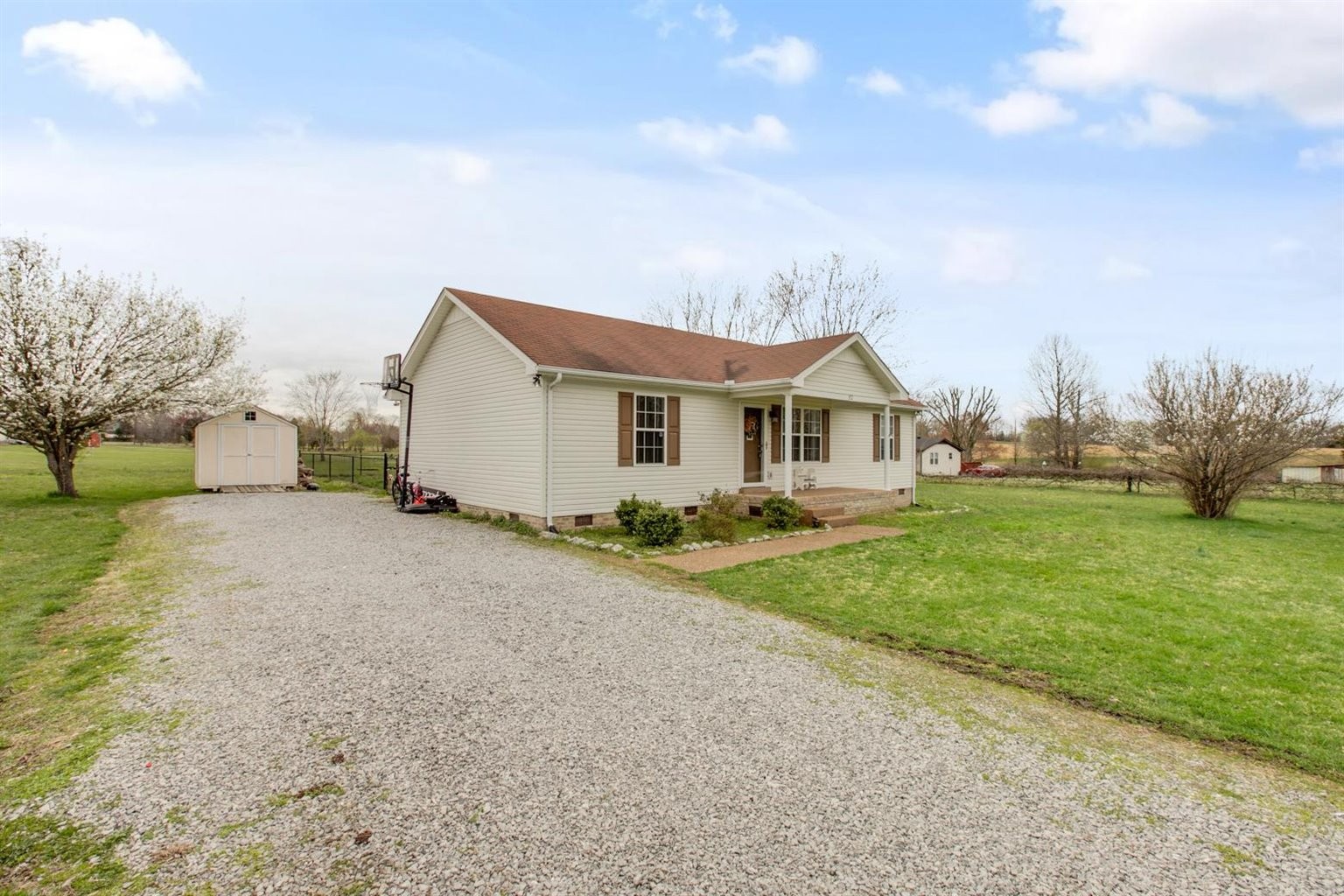 372 Freeland Road Portland, TN 37148 - Photo 3 of 41 a view of a house with backyard and trees