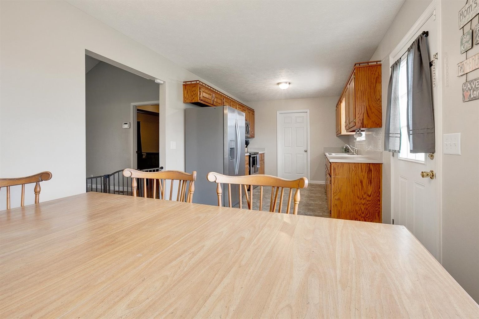 372 Freeland Road Portland, TN 37148 - Photo 22 of 41 a view of a kitchen with dining area wooden floor and windows