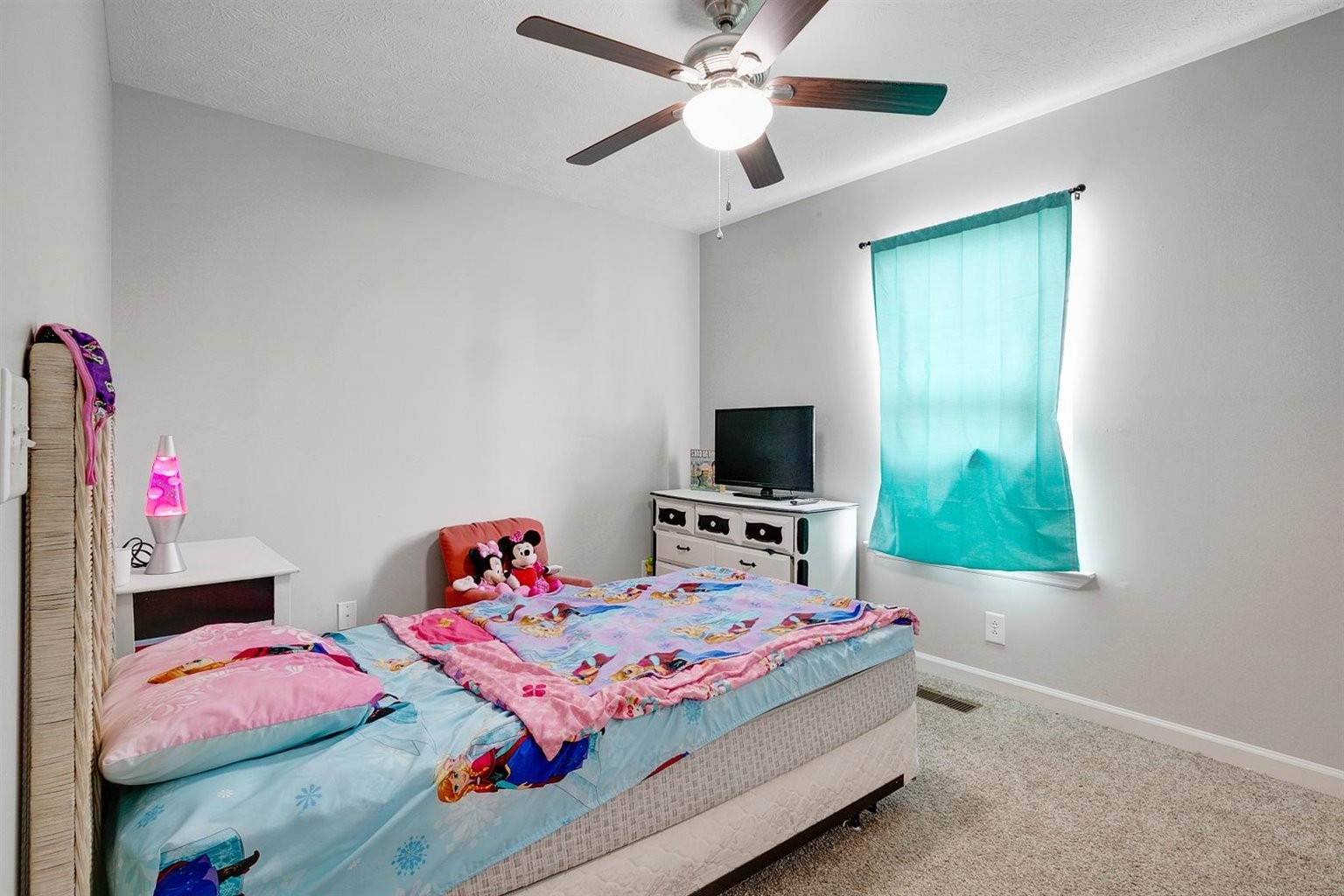 372 Freeland Road Portland, TN 37148 - Photo 26 of 41 a bedroom with a bed a flat screen tv and a dresser