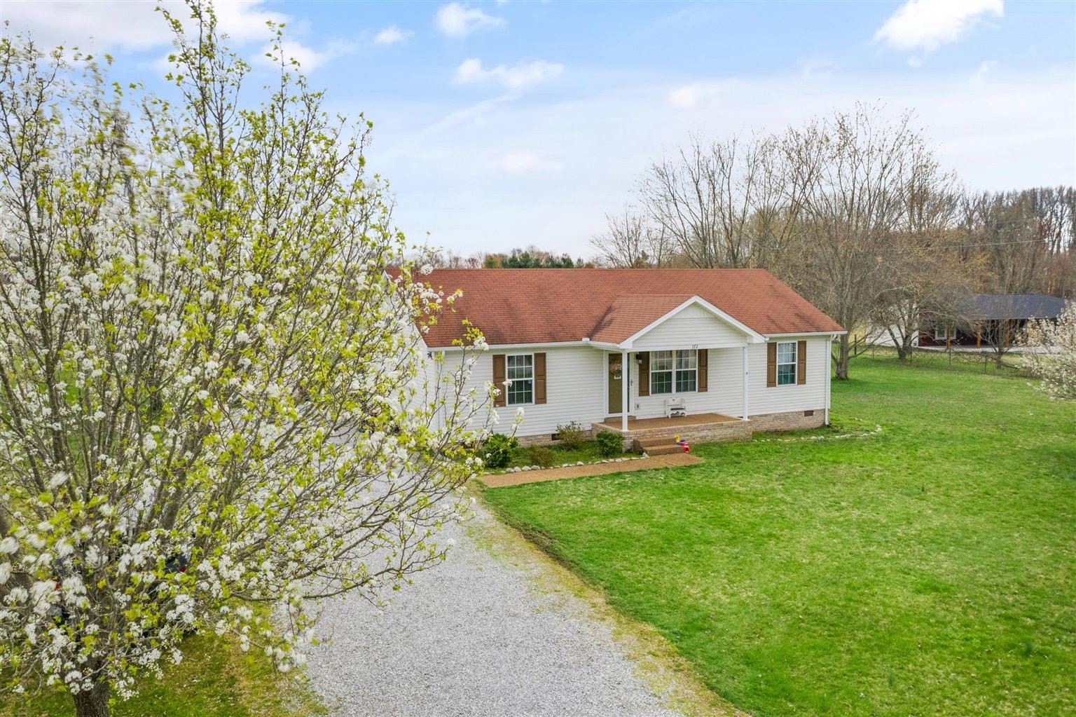 372 Freeland Road Portland, TN 37148 - Photo 32 of 41 a front view of a house with a garden