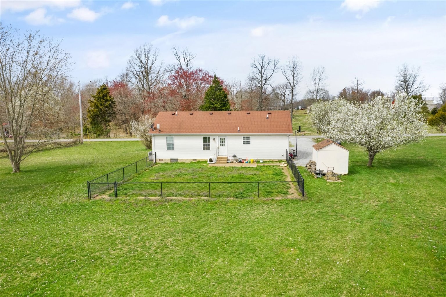 372 Freeland Road Portland, TN 37148 - Photo 38 of 41 a house with green field in front of it