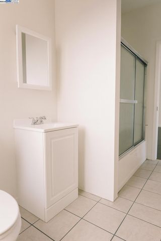 a view of a livingroom with wooden floor and a window