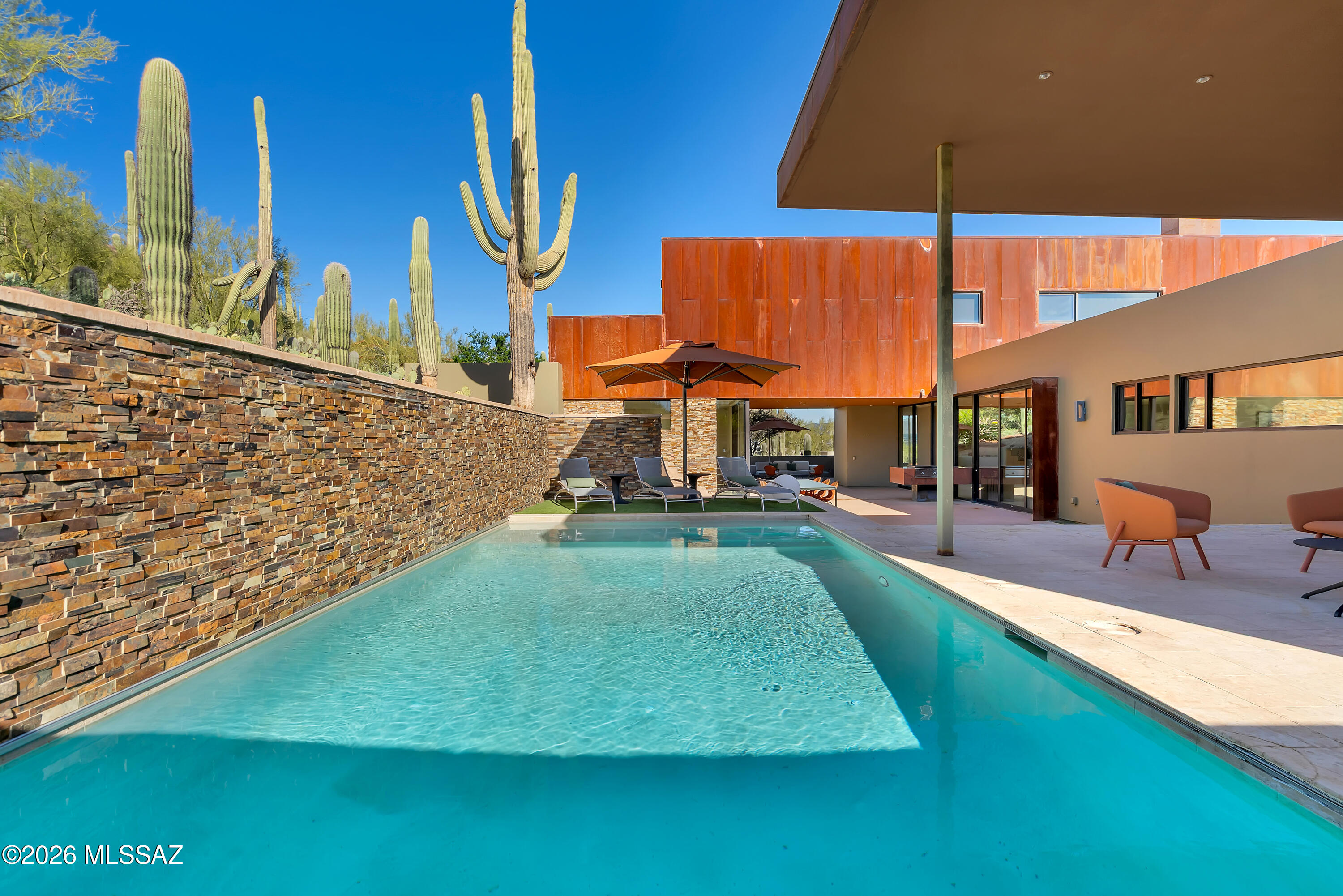 9971 North Silverbell Road Marana, AZ 85653 - Photo 27 of 34 an aerial view of a house with swimming pool