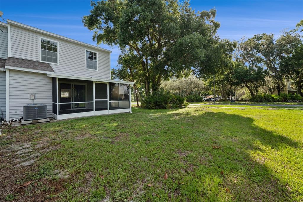 498 Green Spring Circle Winter Springs, FL 32708 - Photo 18 of 20 a view of a house with backyard and garden