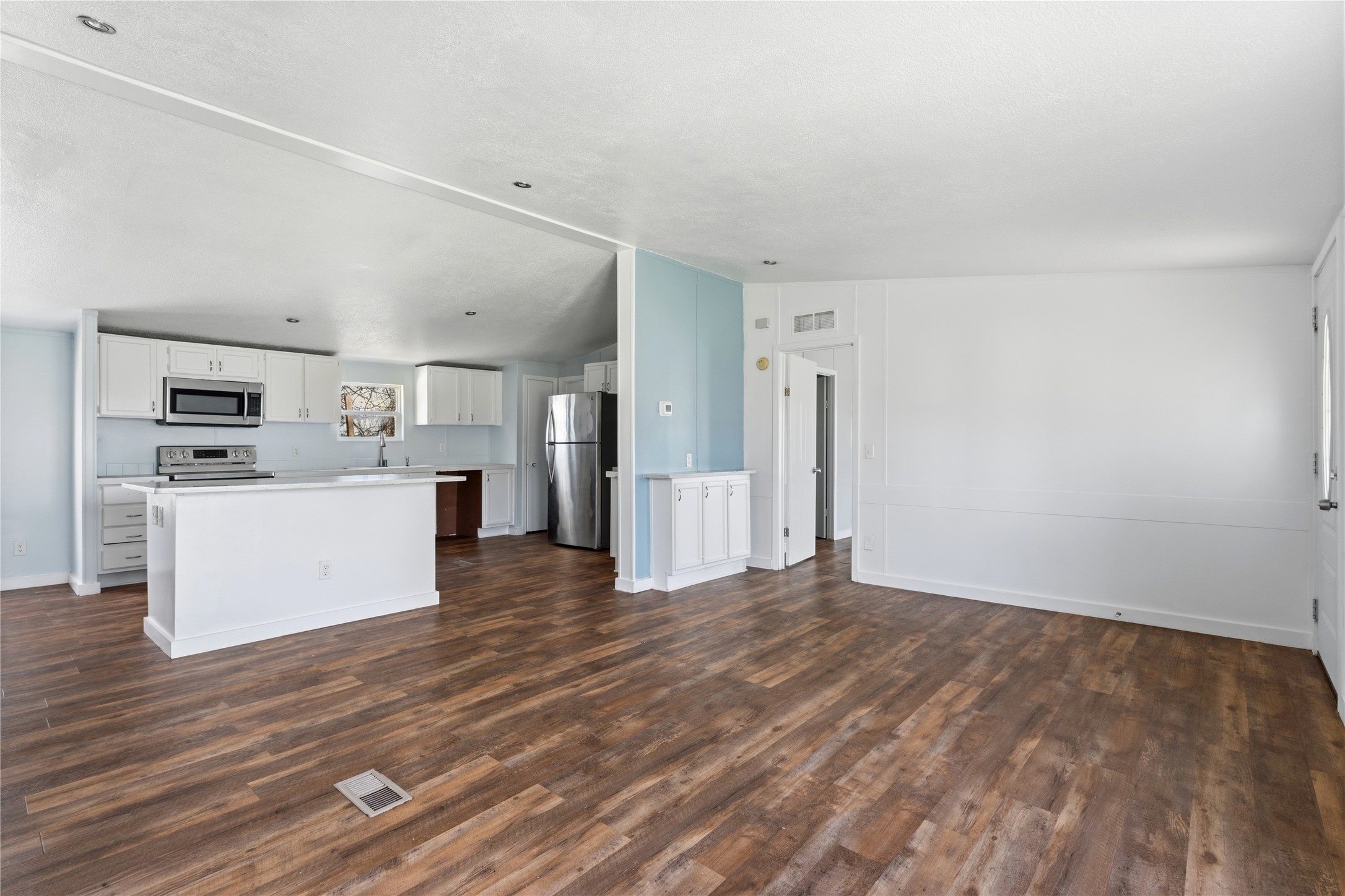 1029 Old McDade Road, Unit C Elgin, TX 78621 - Photo 11 of 33 a view of a kitchen with wooden floor