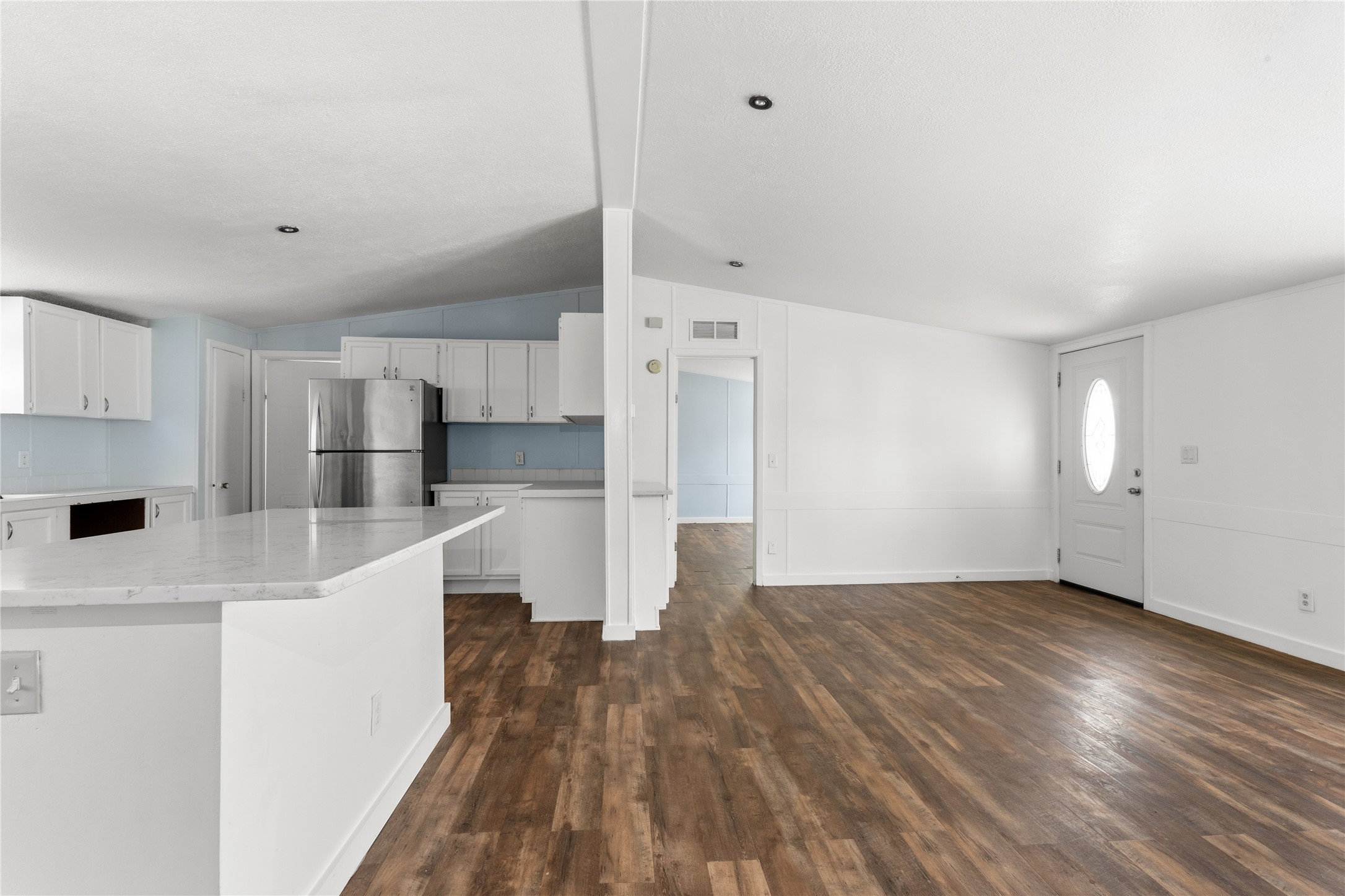 1029 Old McDade Road, Unit C Elgin, TX 78621 - Photo 33 of 33 a view of kitchen with stainless steel appliances refrigerator stove and wooden cabinets