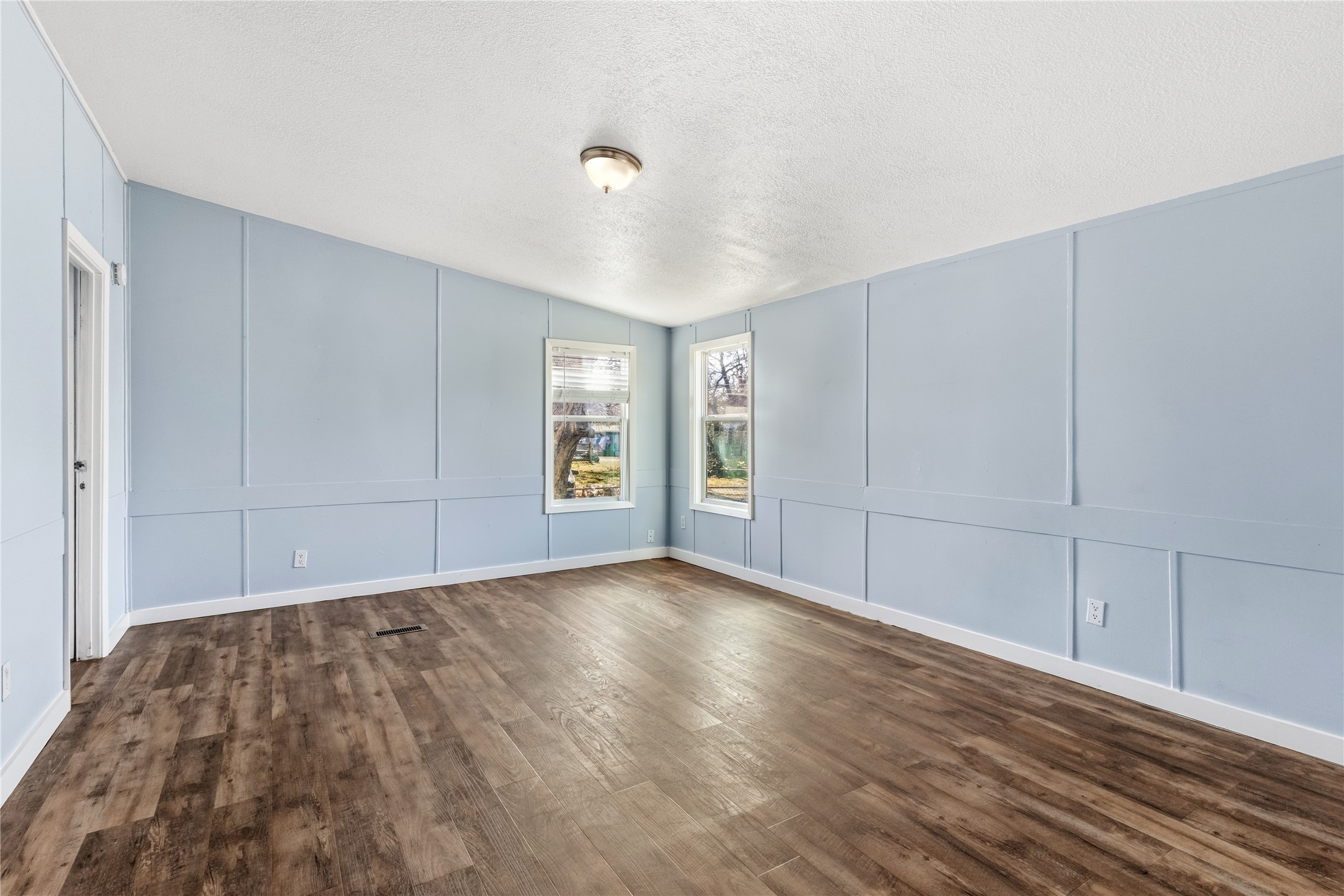 1029 Old McDade Road, Unit C Elgin, TX 78621 - Photo 19 of 33 a view of livingroom with hardwood floor and window