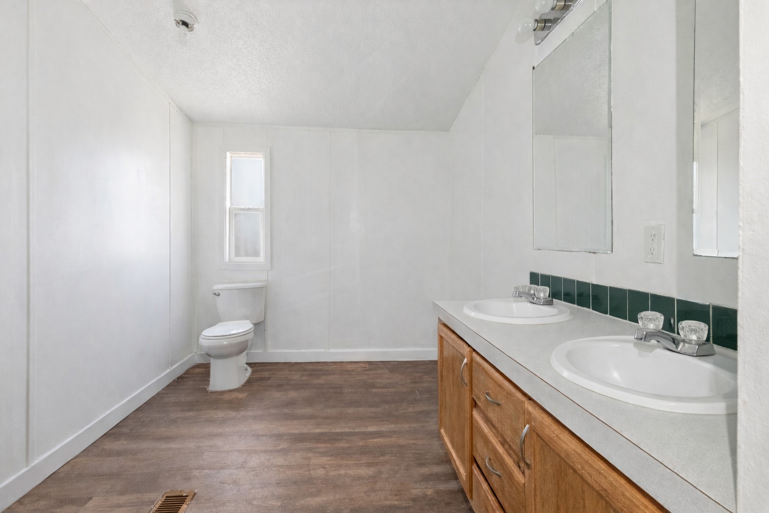 1029 Old McDade Road, Unit C Elgin, TX 78621 - Photo 22 of 33 a bathroom with a sink toilet and vanity