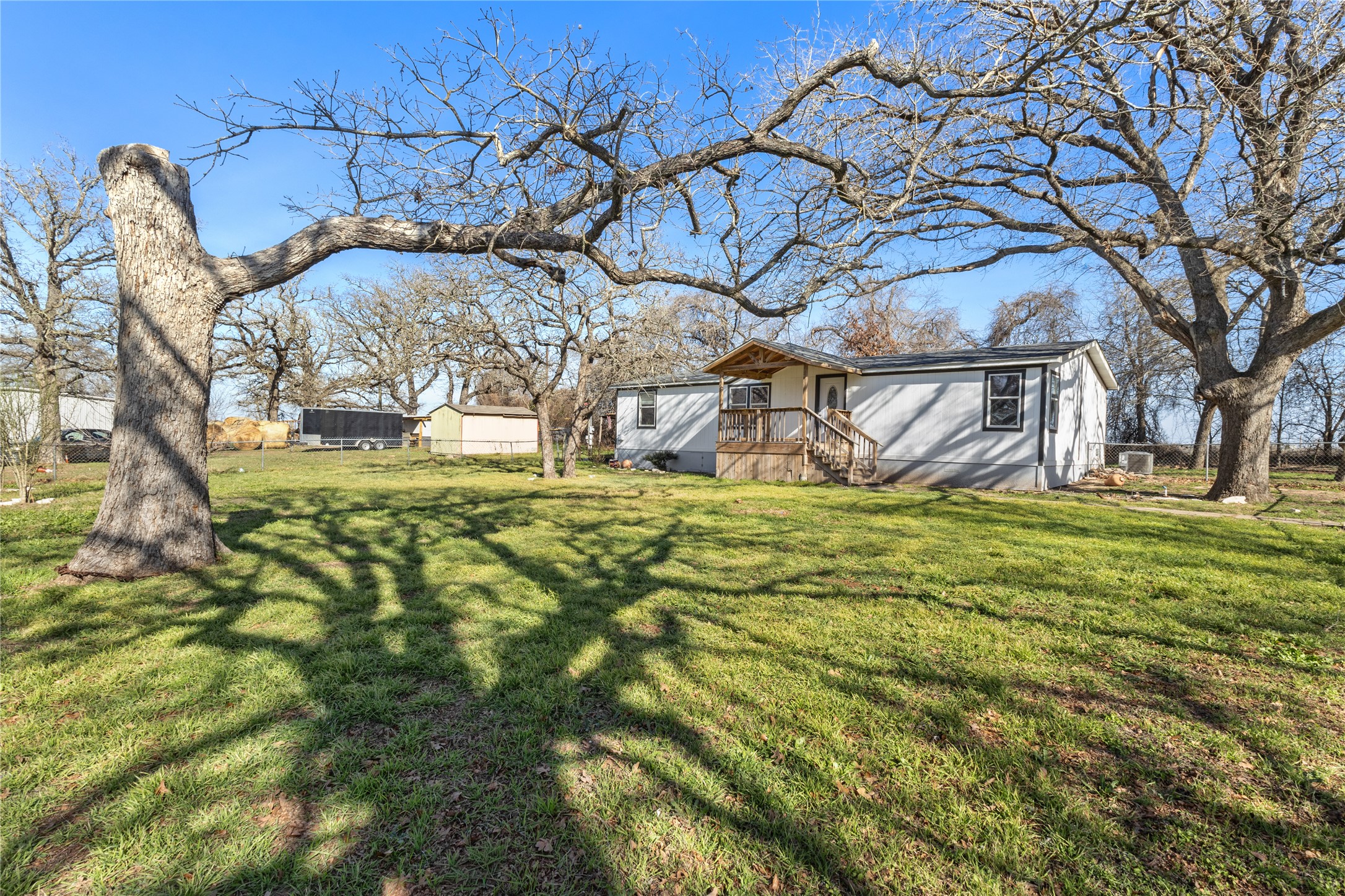 1029 Old McDade Road, Unit C Elgin, TX 78621 - Photo 4 of 33 a view of yard with large tree