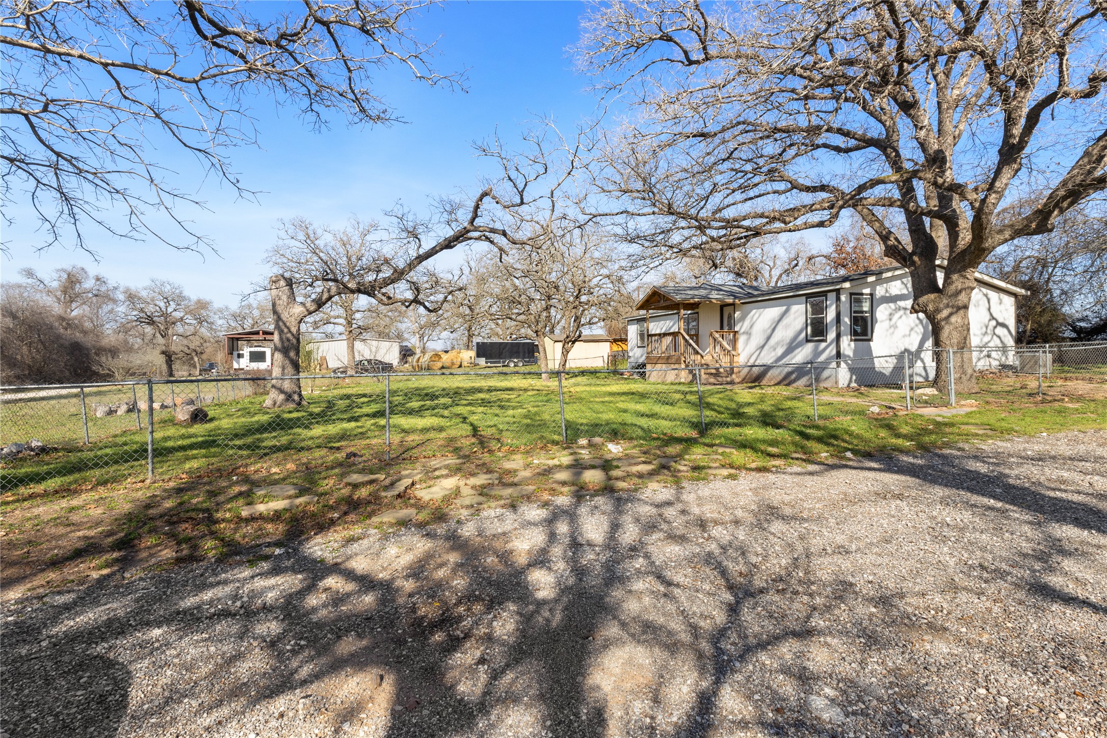 1029 Old McDade Road, Unit C Elgin, TX 78621 - Photo 7 of 33 a backyard of a house with lots of green space