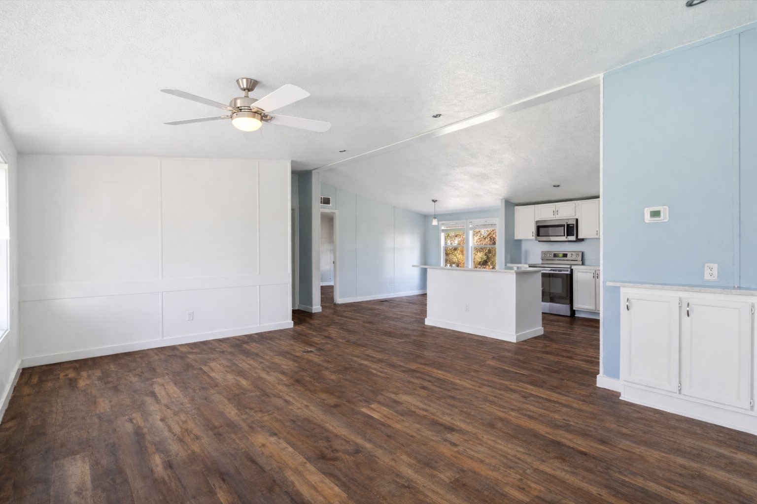 1029 Old McDade Road, Unit C Elgin, TX 78621 - Photo 9 of 33 a view of a kitchen with wooden floor and a kitchen