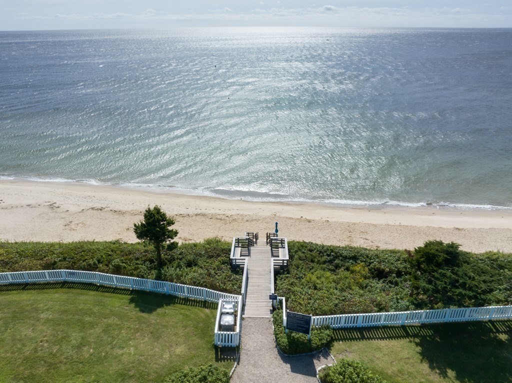 3 Hydrangea Lane, Unit 3 Mashpee, MA 02649 - Photo 15 of 18 a view of a lake with a mountain in the background