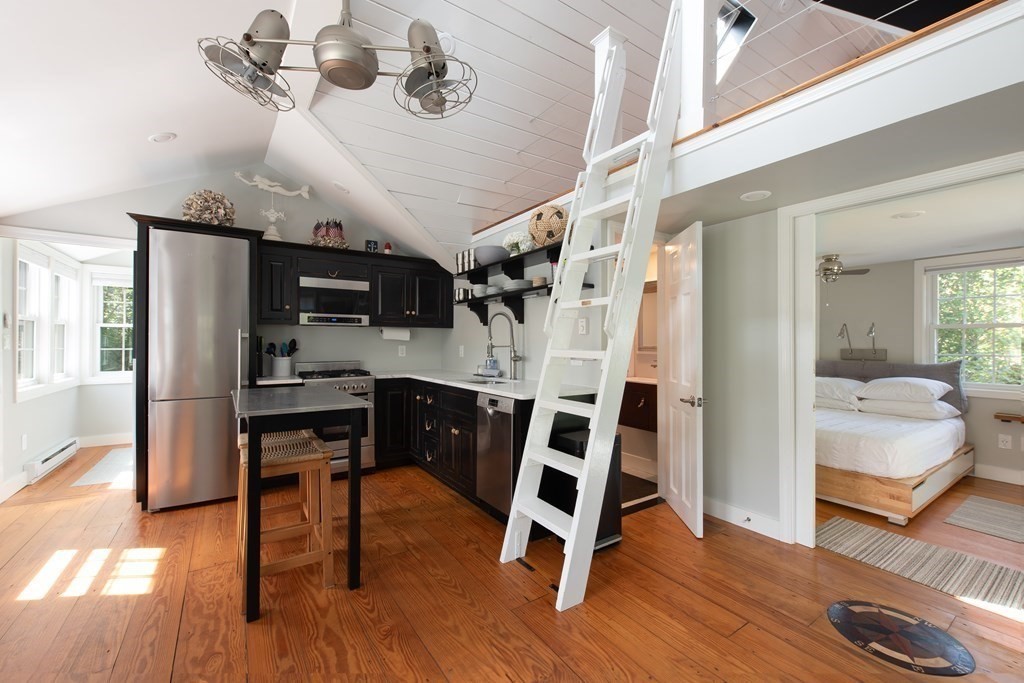 3 Hydrangea Lane, Unit 3 Mashpee, MA 02649 - Photo 5 of 18 a view of a dining room with furniture and wooden floor