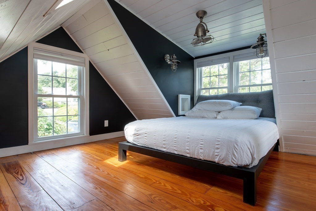 3 Hydrangea Lane, Unit 3 Mashpee, MA 02649 - Photo 10 of 18 a spacious bedroom with a bed and a window