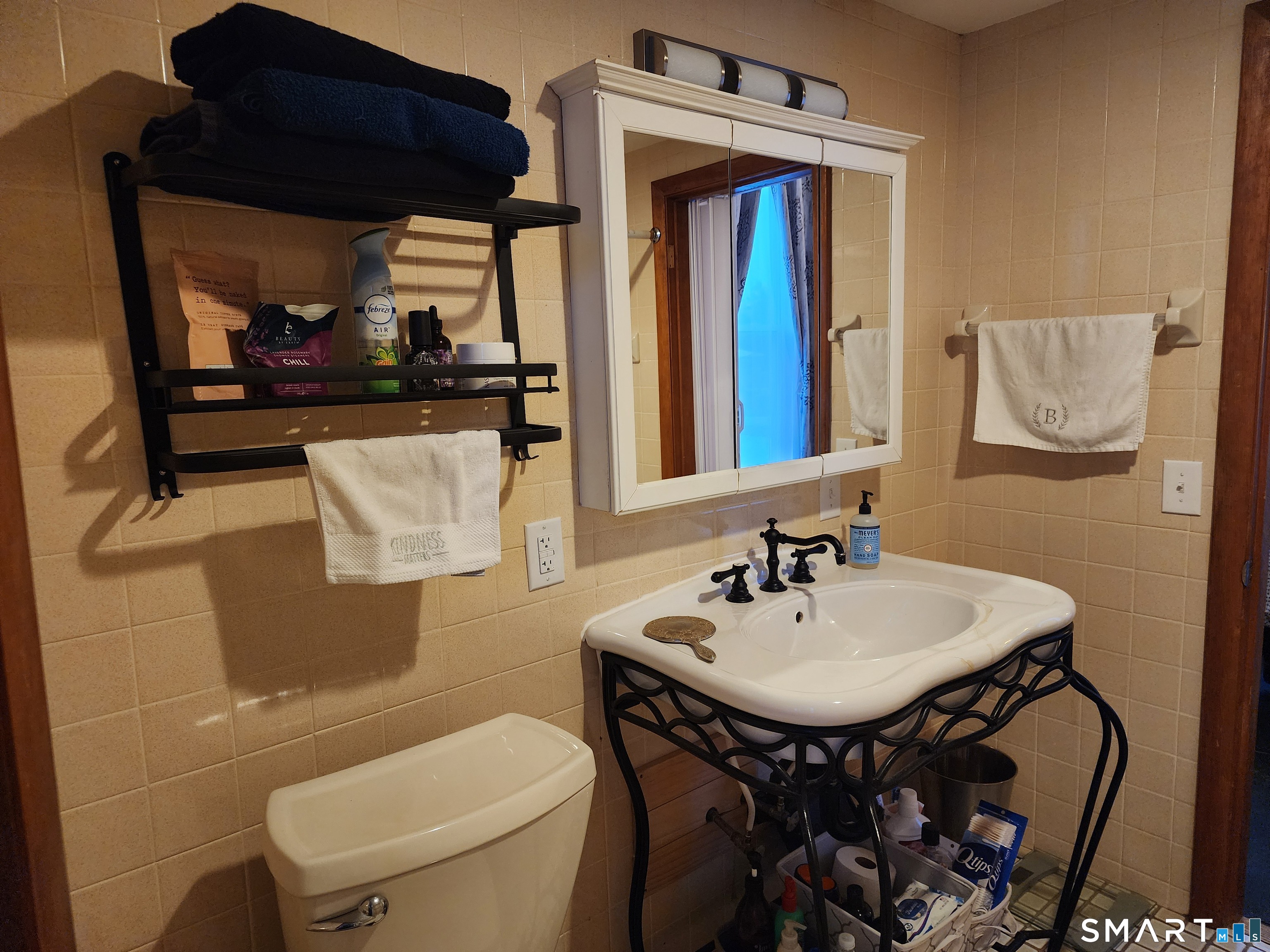 350 Hartford Pike Killingly, CT 06241 - Photo 15 of 28 a bathroom with a sink a toilet and mirror