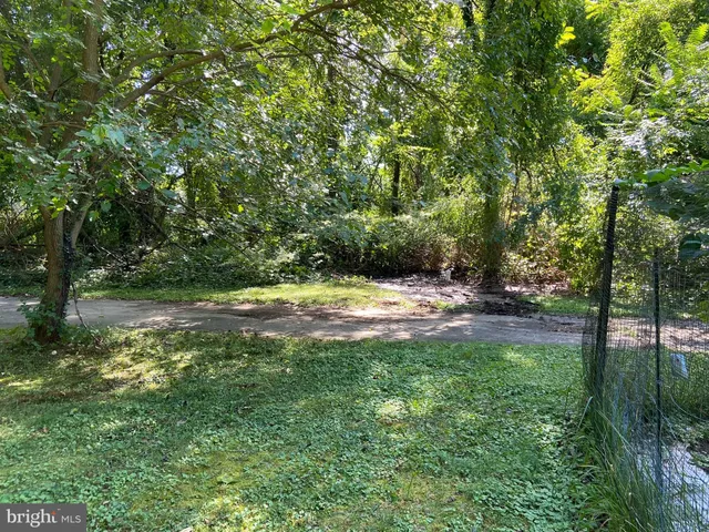 a view of swimming pool with a yard