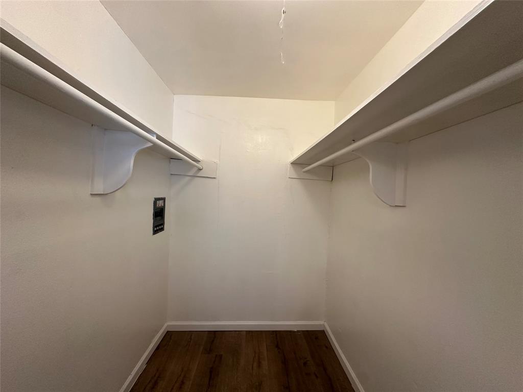 4618 Reiger Avenue, Unit 101 Dallas, TX 75246 - Photo 14 of 17 a view of a room with racks on the wall