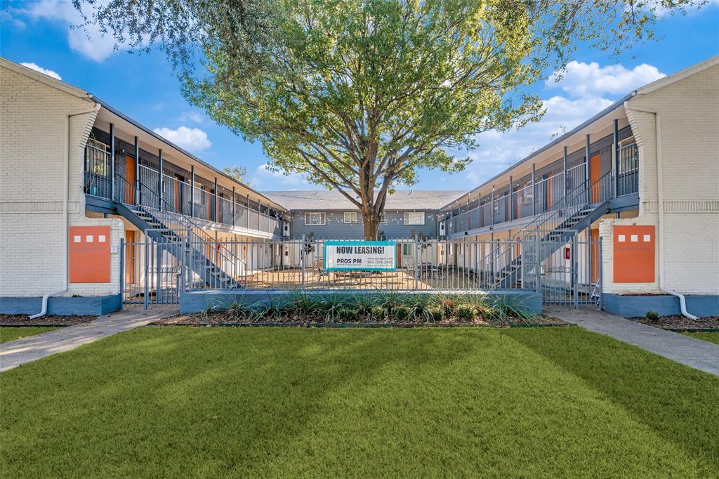 4618 Reiger Avenue, Unit 101 Dallas, TX 75246 - Photo 15 of 17 a front view of a building with a garden