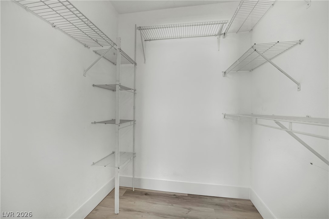 8101 West Flamingo Road, Unit 2030 Las Vegas, NV 89147 - Photo 22 of 27 An organized closet offers generous shelving and ample storage space.