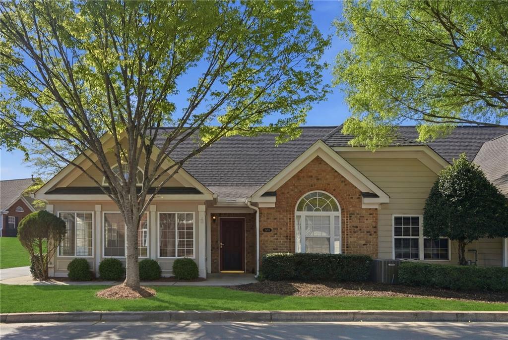 2994 Oakside Circle Alpharetta, GA 30004 - Photo 1 of 32 a front view of a house with a yard