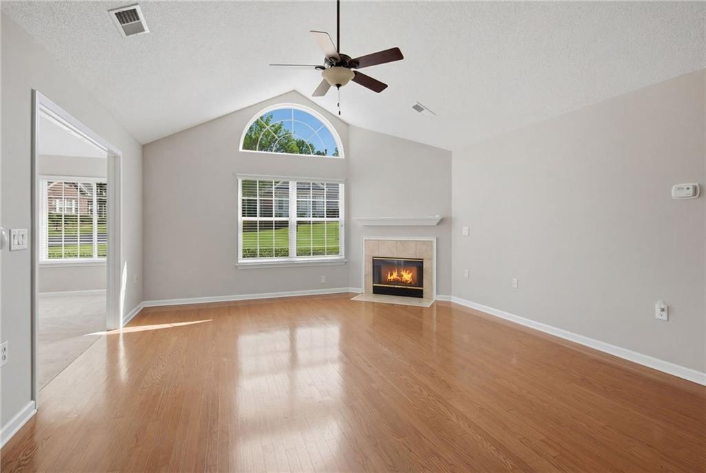 2994 Oakside Circle Alpharetta, GA 30004 - Photo 11 of 32 a view of an empty room with a window and wooden floor