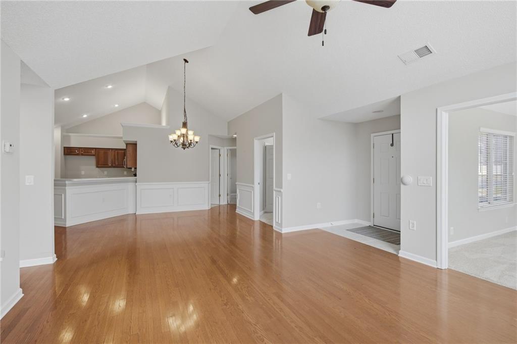 2994 Oakside Circle Alpharetta, GA 30004 - Photo 13 of 32 a view of a livingroom with a ceiling fan wooden floor and a ceiling fan