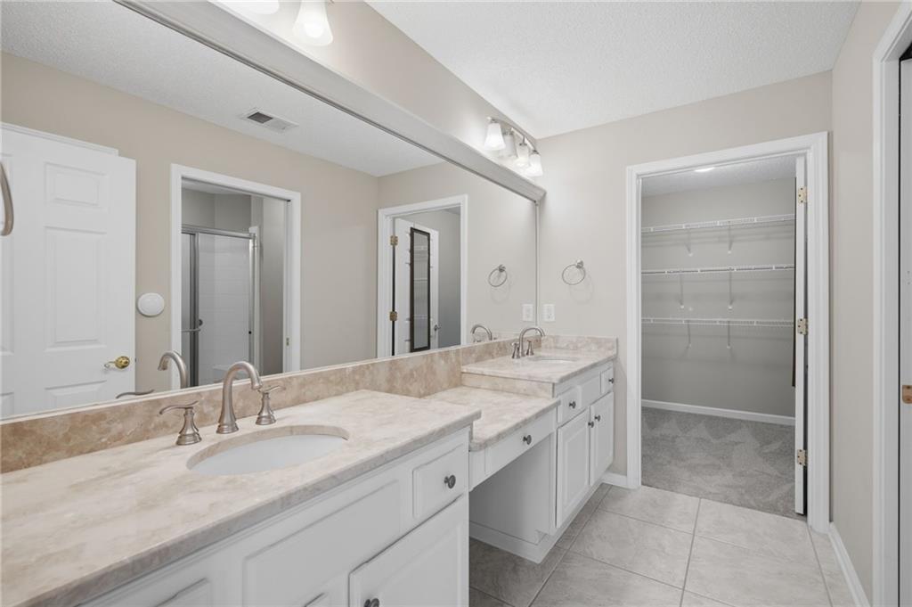 2994 Oakside Circle Alpharetta, GA 30004 - Photo 22 of 32 a bathroom with a granite countertop sink mirror and double