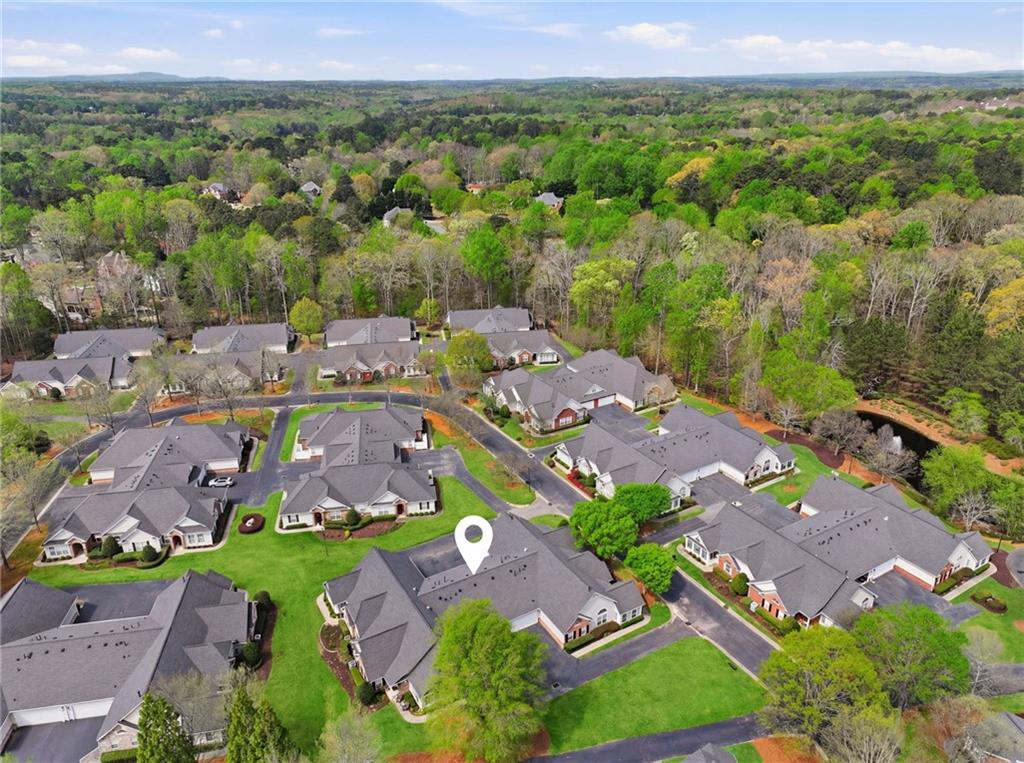 2994 Oakside Circle Alpharetta, GA 30004 - Photo 31 of 32 an aerial view of residential houses with outdoor space and parking