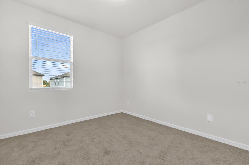 4556 Homestead Trail St. Cloud, FL 34772 - Photo 19 of 31 an empty room with a window
