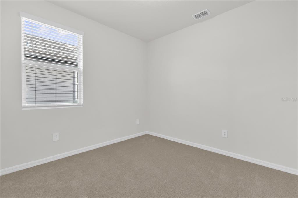 4556 Homestead Trail St. Cloud, FL 34772 - Photo 21 of 31 an empty room with a window