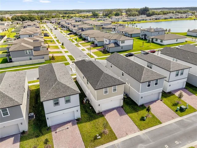 an aerial view of a house with a ocean view