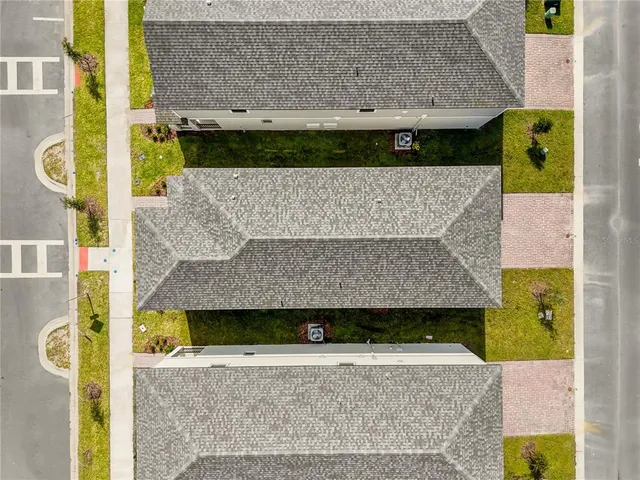 front view of a house with a wall