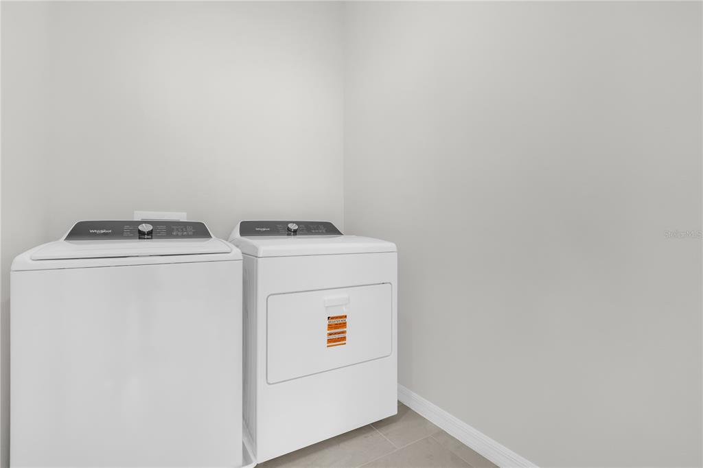 4556 Homestead Trail St. Cloud, FL 34772 - Photo 10 of 31 a utility room with dryer and washer