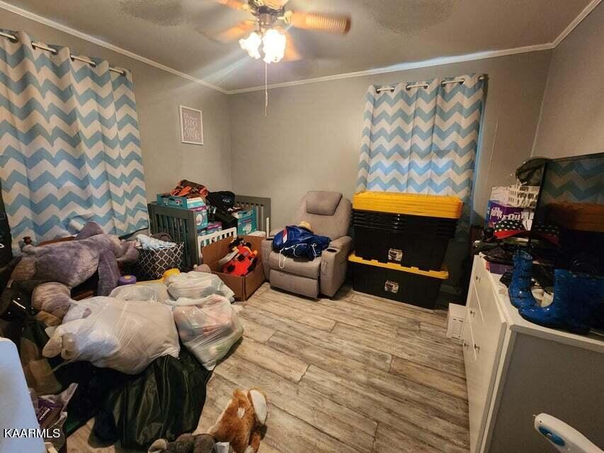 1031 Roberts Ridge Road Ten Mile, TN 37880 - Photo 10 of 21 a bedroom with furniture and a flat screen tv
