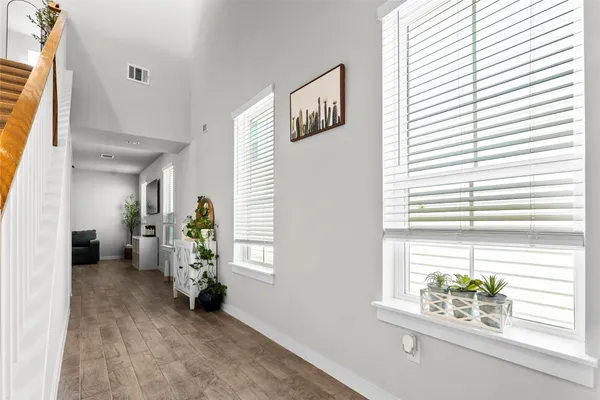 a view of an empty room and a window