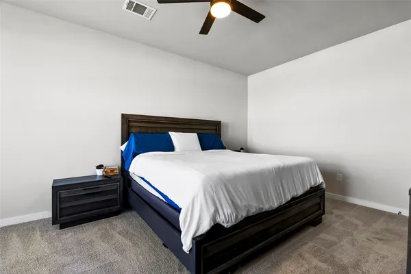 a bed sitting in a room next to a window