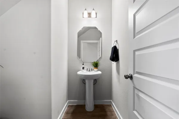 a view of a bathroom with a sink and mirror