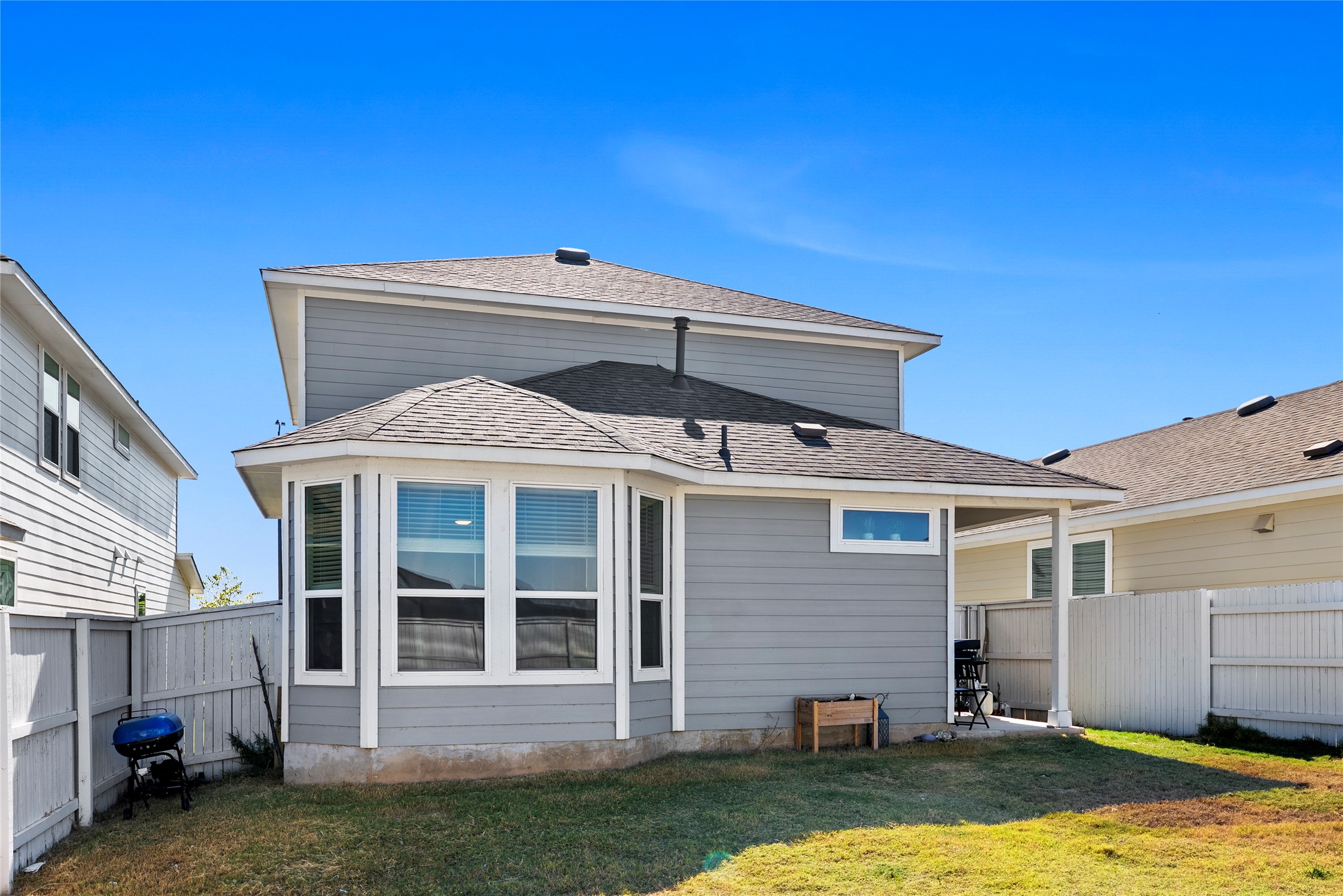 156 Appleberry Lane Elgin, TX 78621 - Photo 27 of 40 Back of house featuring a patio area and a fenced backyard