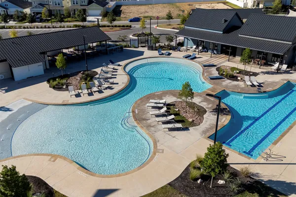 a view of a swimming pool with seating area