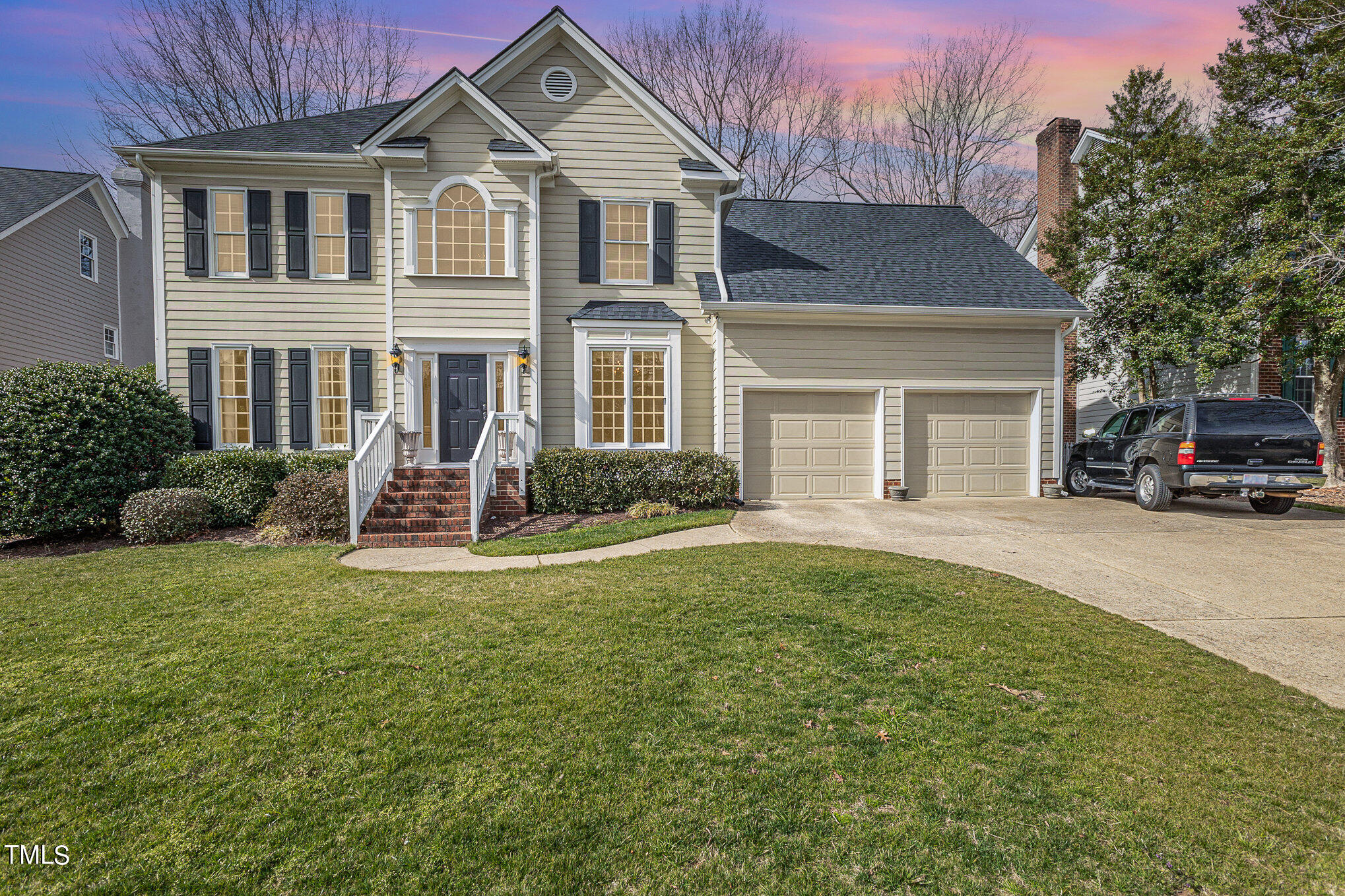 8905 Windjammer Drive Raleigh, NC 27615 - Photo 1 of 1 a front view of a house with a yard and trees