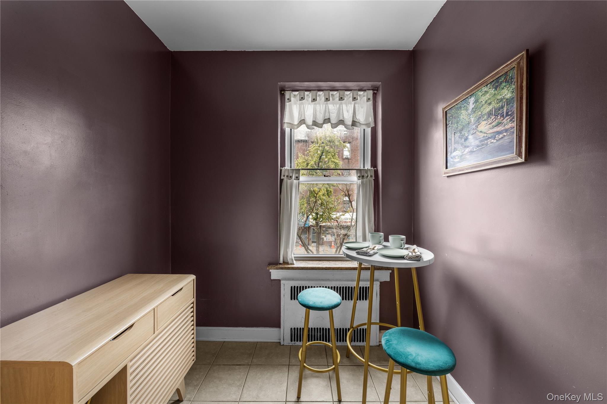 35-05 72nd Street, Unit 2E Queens, NY 11372 - Photo 10 of 14 a room with furniture and a window