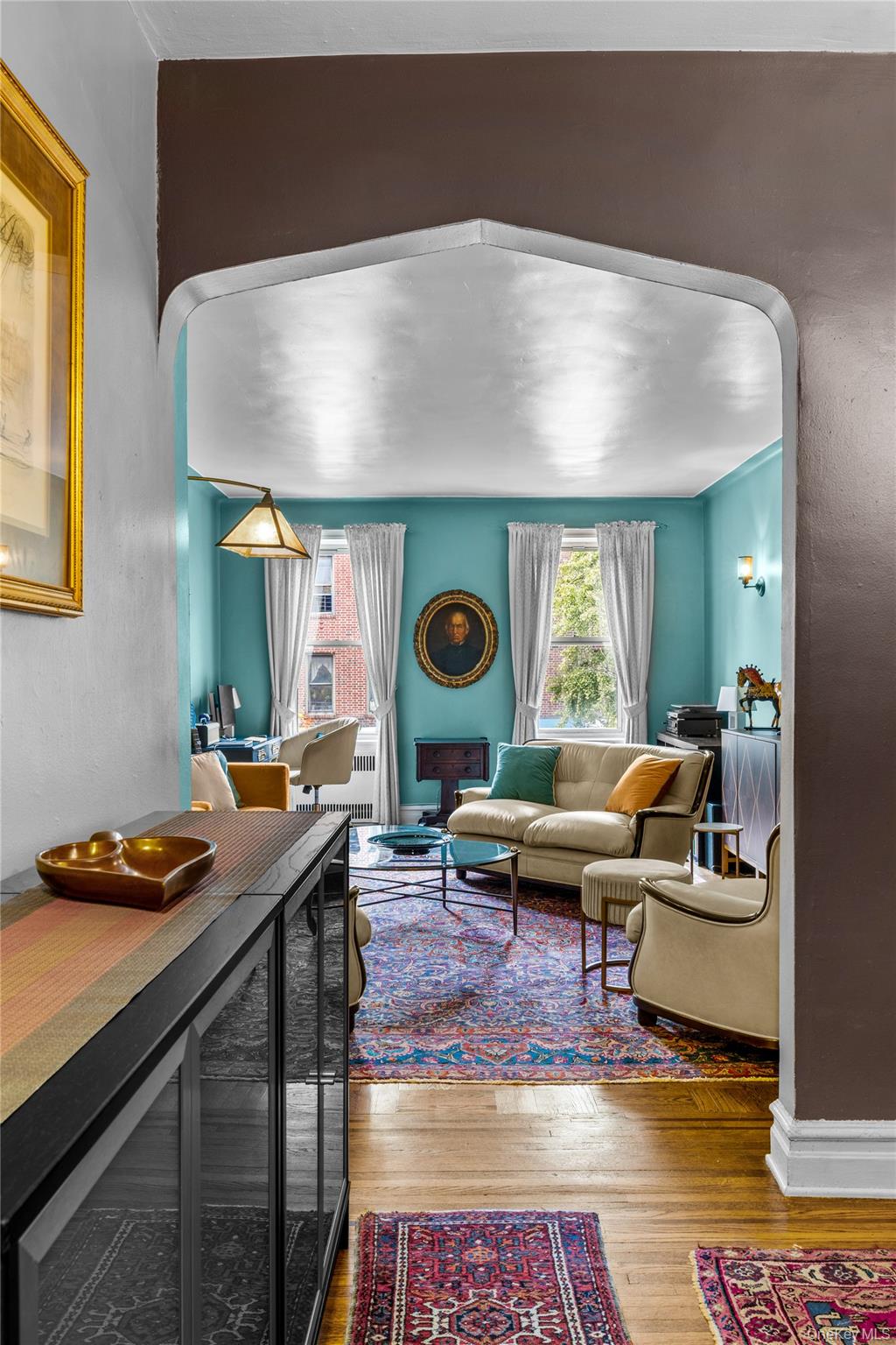 35-05 72nd Street, Unit 2E Queens, NY 11372 - Photo 5 of 14 a living room with furniture and a rug