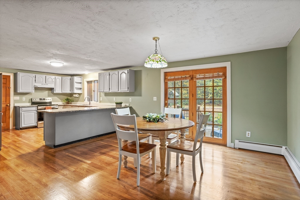 93 Turner Road Townsend, MA 01469 - Photo 13 of 32 a view of a dining room with furniture window and wooden floor