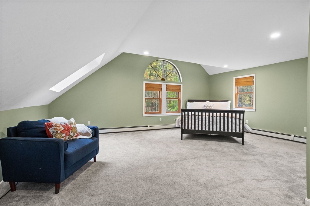 93 Turner Road Townsend, MA 01469 - Photo 25 of 32 a bedroom with a bed and a window