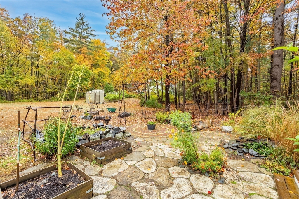 93 Turner Road Townsend, MA 01469 - Photo 30 of 32 a view of a yard with plants and large trees